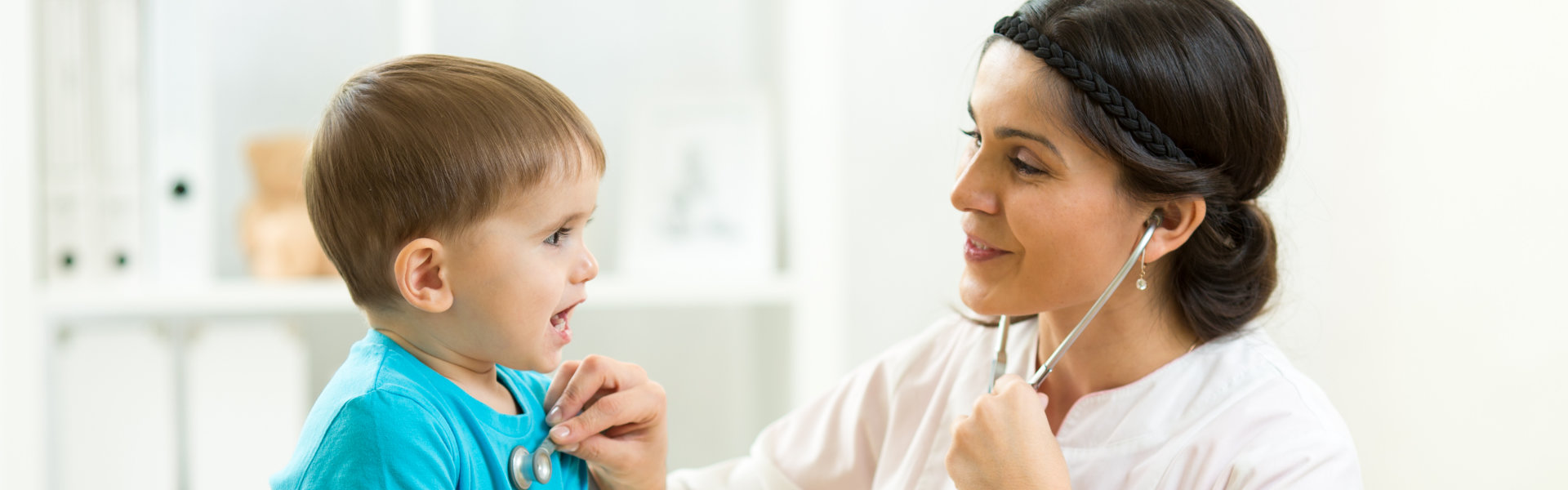 female doctor examining a child