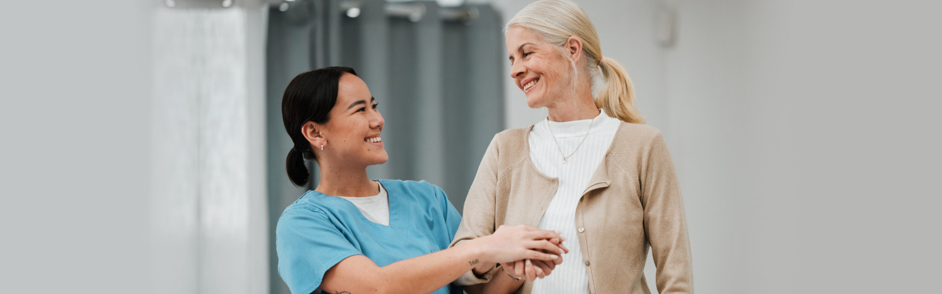 Female nurse assists elderly patient