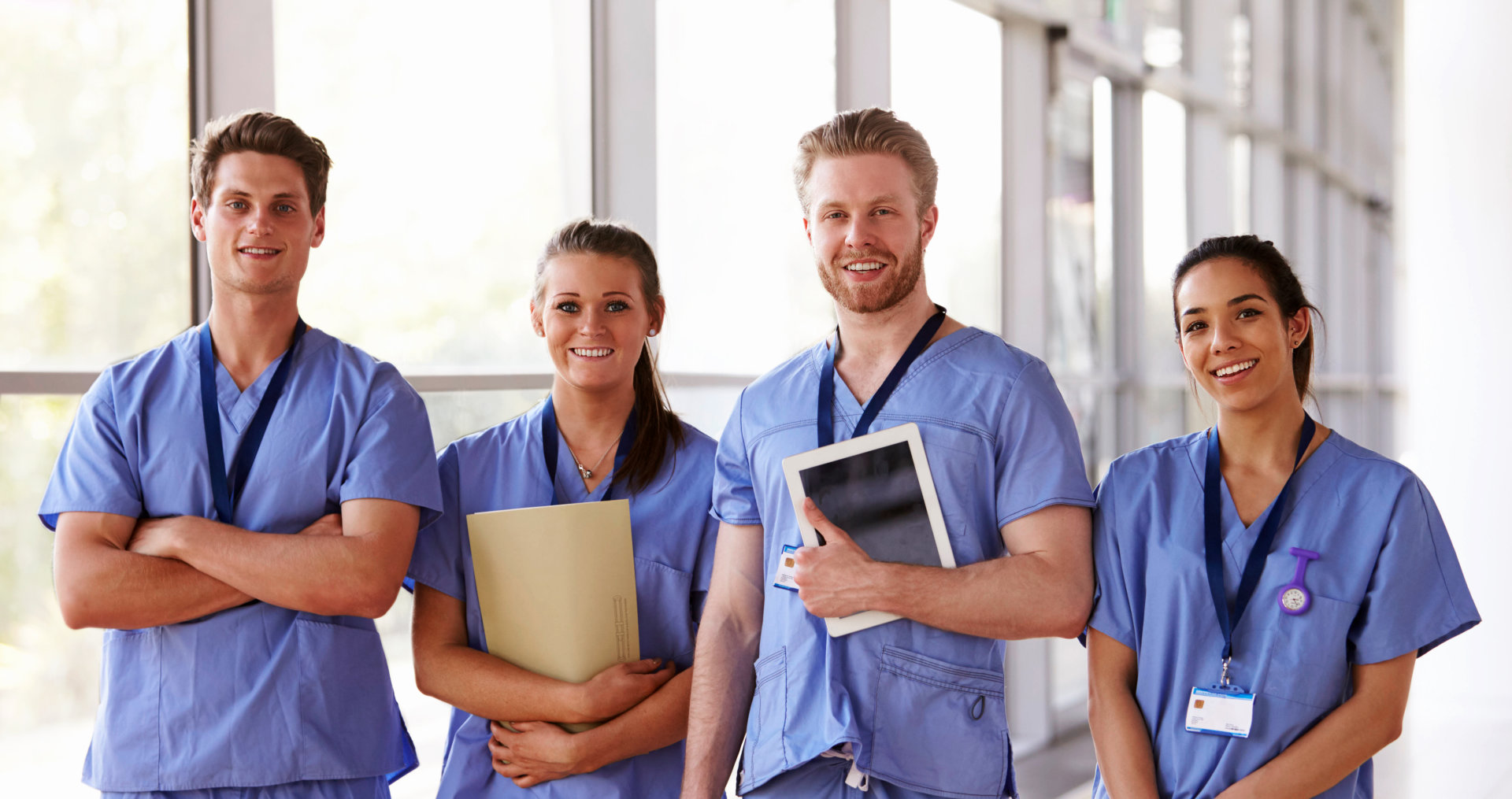 healthcare workers in hospital corridor